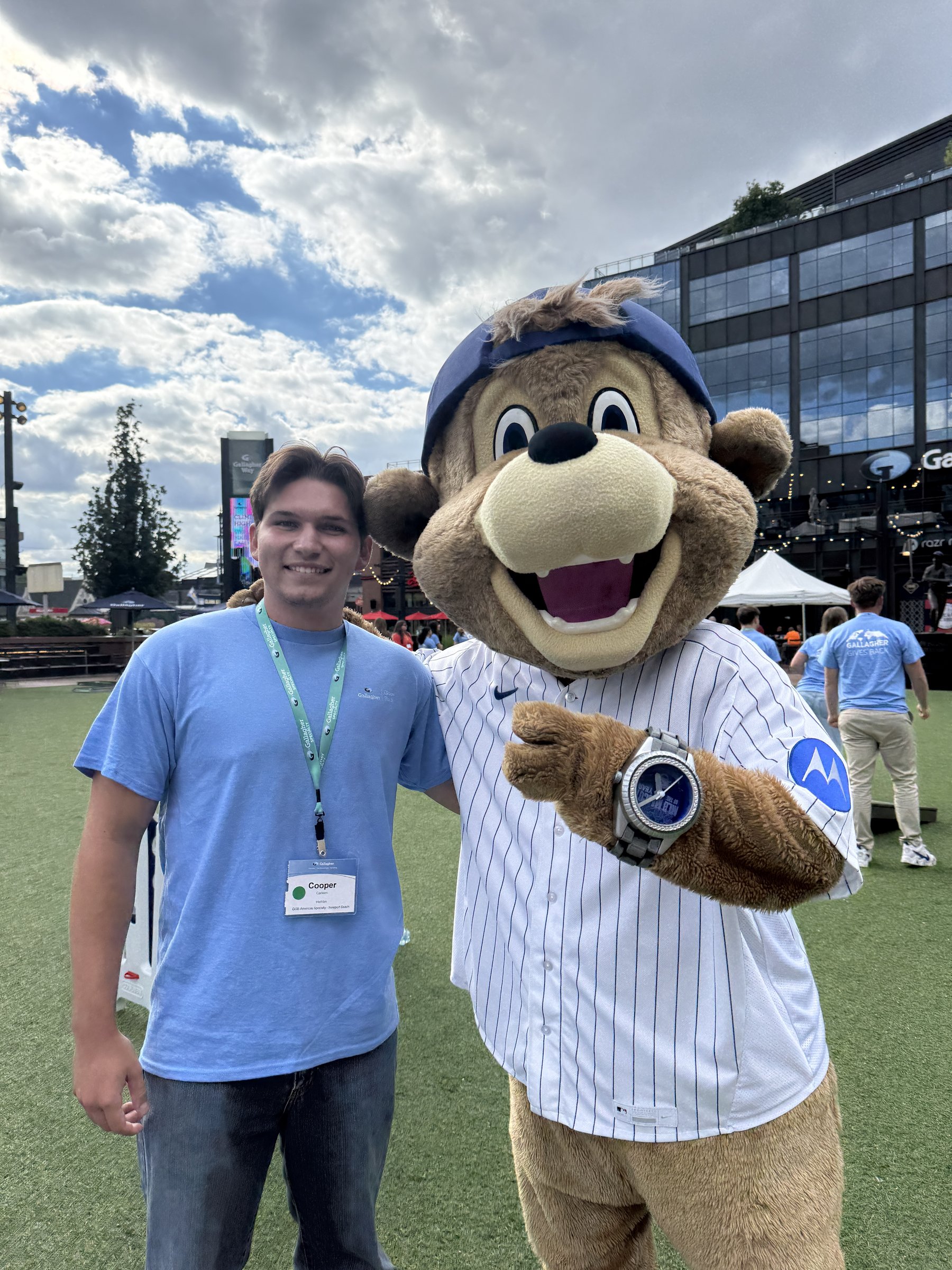 Cooper Carlsen with the Gallagher bear mascot at a company event